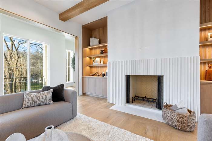 A living room with a fireplace and a couch.