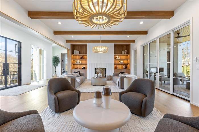 A living room filled with furniture and a fireplace.