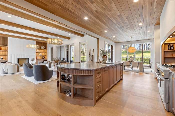 There is a large island in the middle of the kitchen.