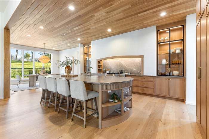 There is a large island in the middle of the kitchen.