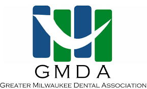 The logo for the greater milwaukee dental association