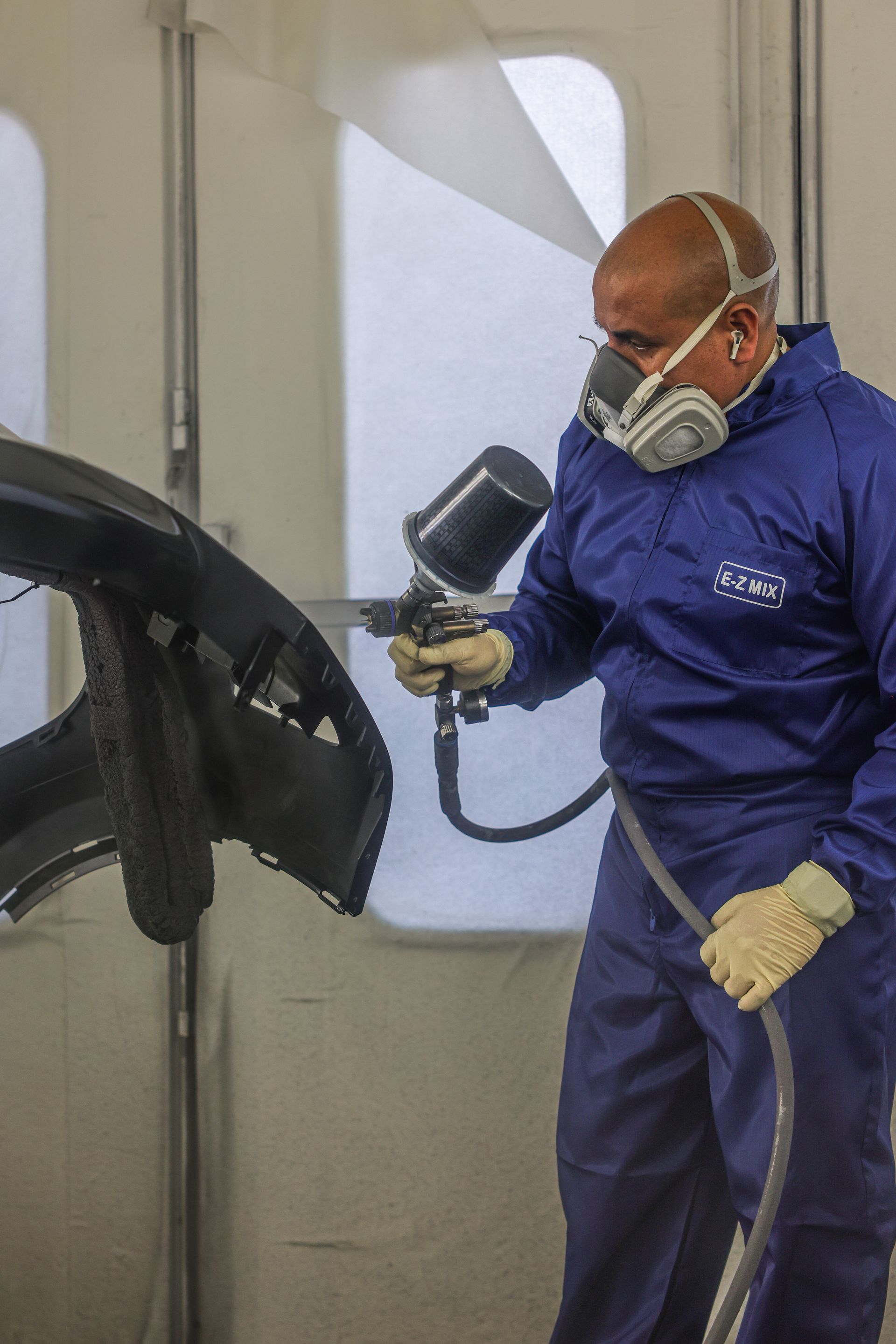 The rear end of a black mercedes benz glc coupe with a california license plate.