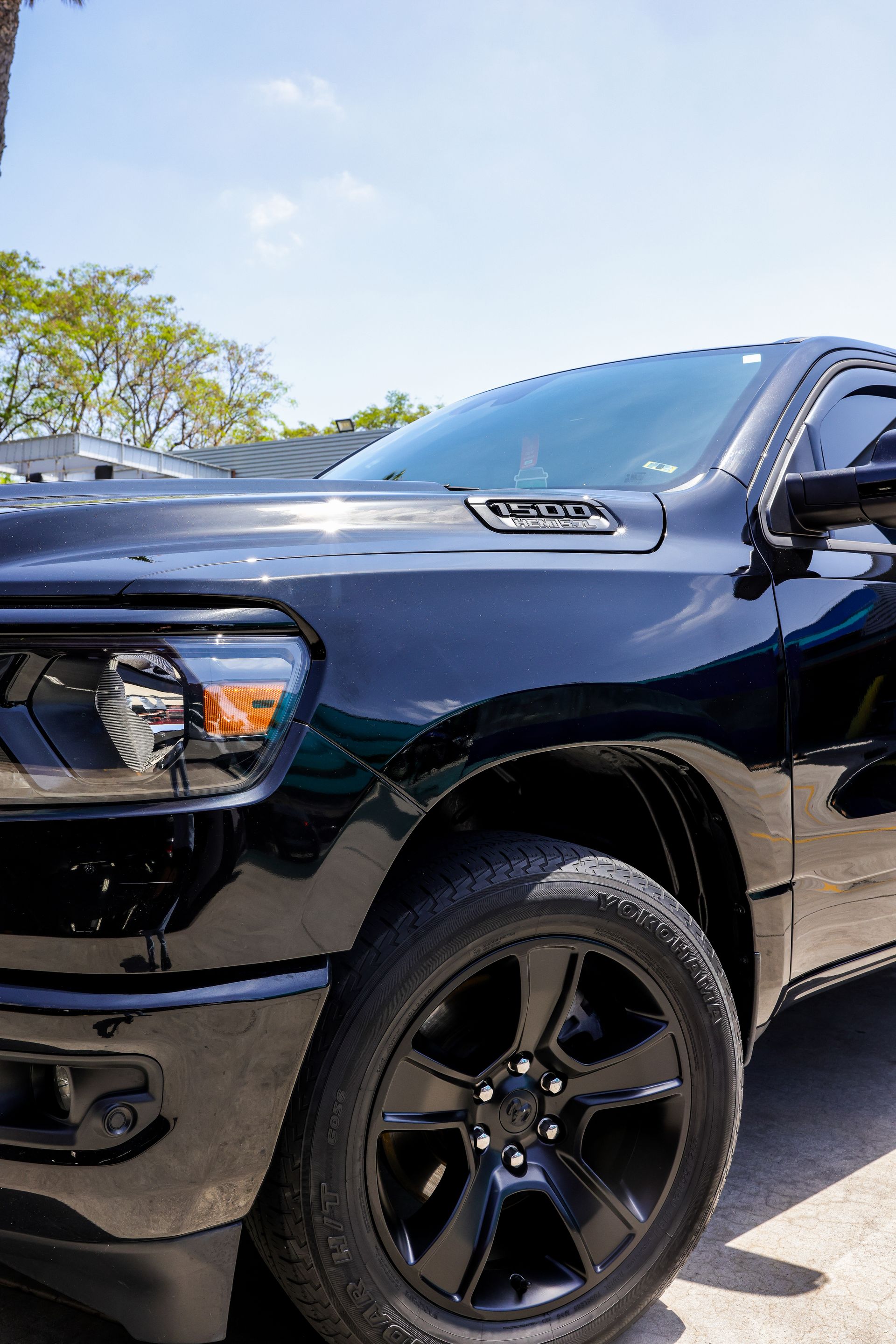 A black mercedes benz glc is parked in a parking lot.