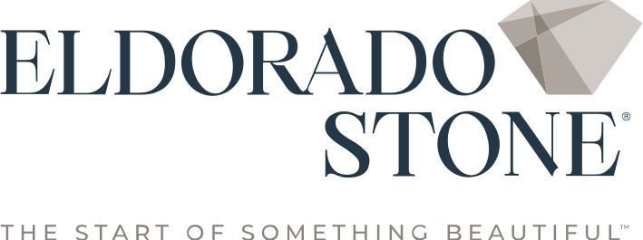 Logo for Eldorado Stone featuring dark blue text and a grey, geometric stone icon with the slogan below.