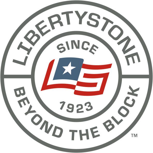 Logo for Libertystone Hardscaping Systems featuring the text in grey and a red, white, and blue flag icon with 