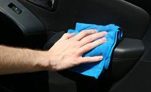 Man cleaning inside the car