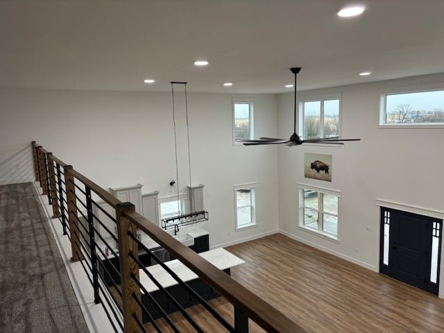 a view of a living room from the second floor of a house