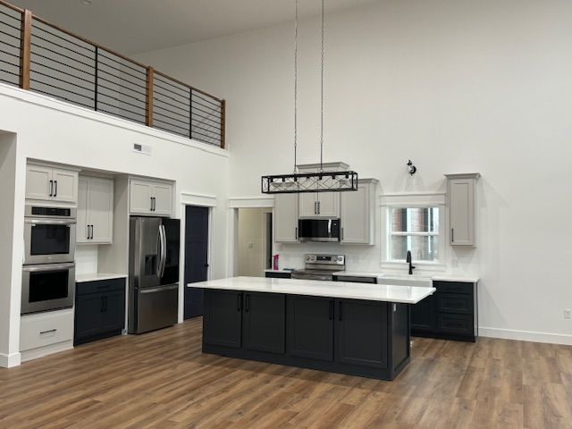 a kitchen with a large island in the middle of the room