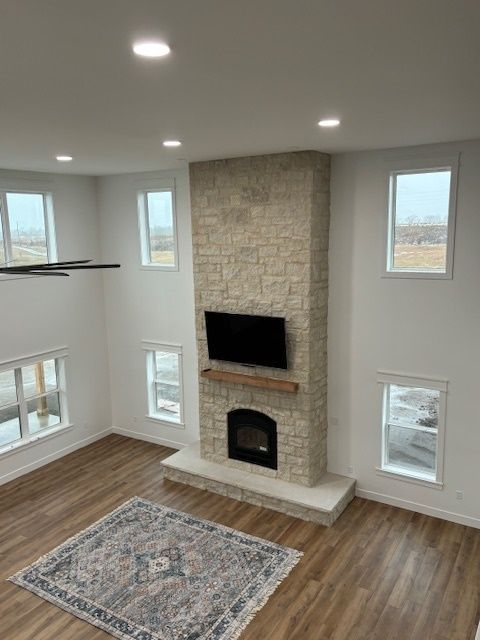 a living room with a fireplace and a flat screen tv