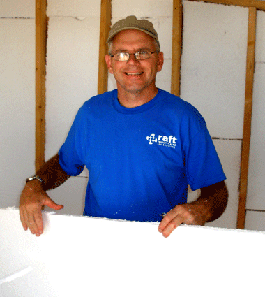 A man wearing a blue shirt with the word craft on it