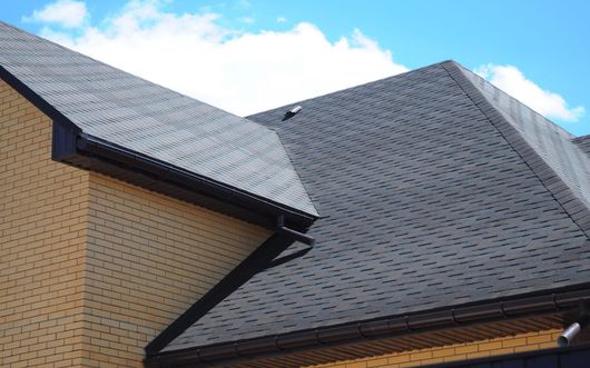 Metal roofing with gutters
