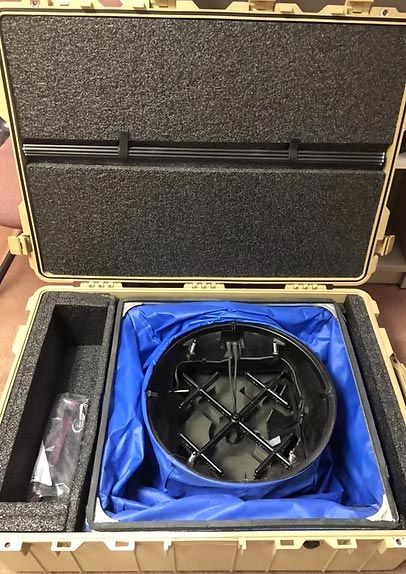 The inside of a case with a blue bag in it.