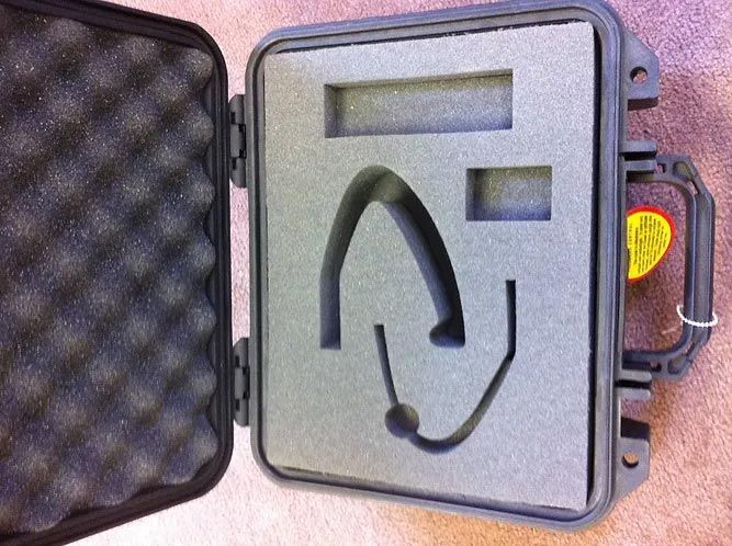 A foam case with a headset inside of it