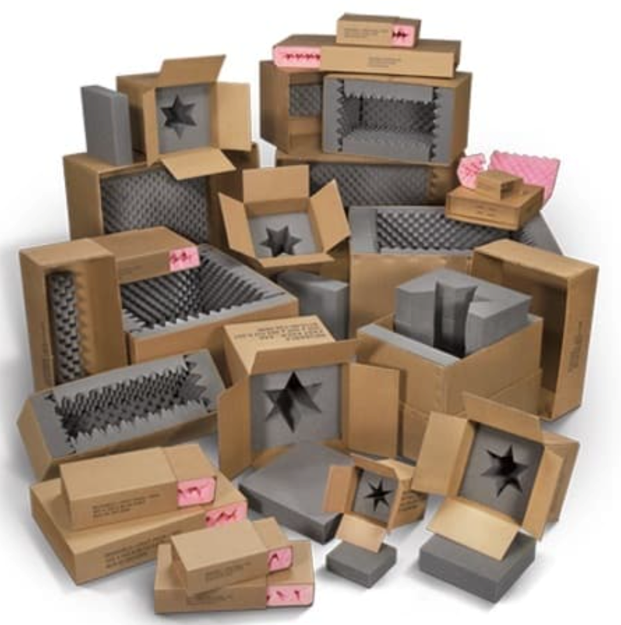 Cardboard boxes with foam inserts, various sizes, shapes, and designs for protective packaging.