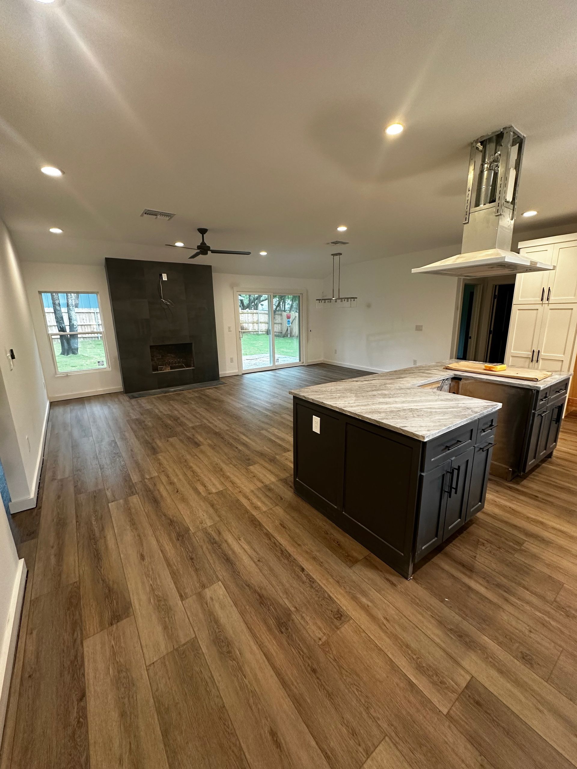 A kitchen with a large island in the middle of the room.