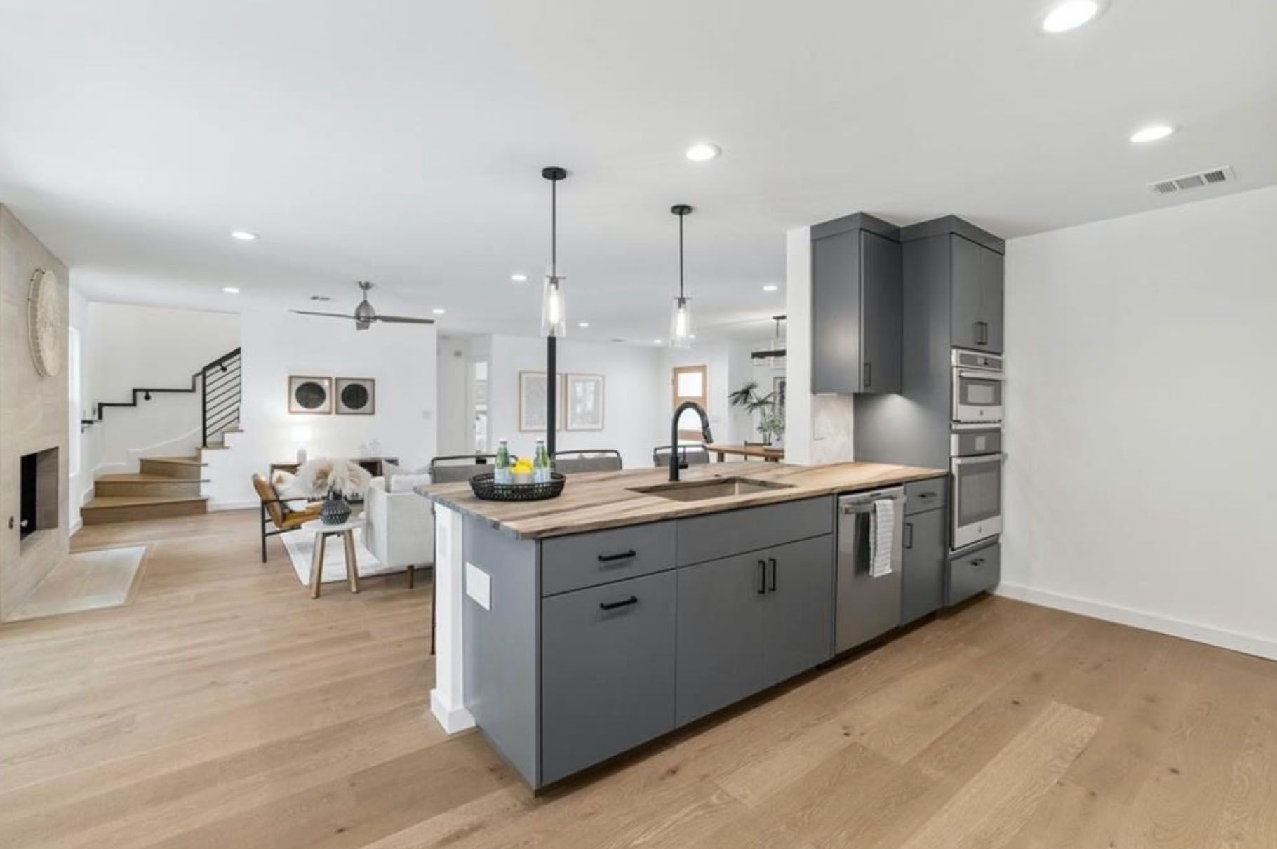 A kitchen with a large island in the middle of the room.