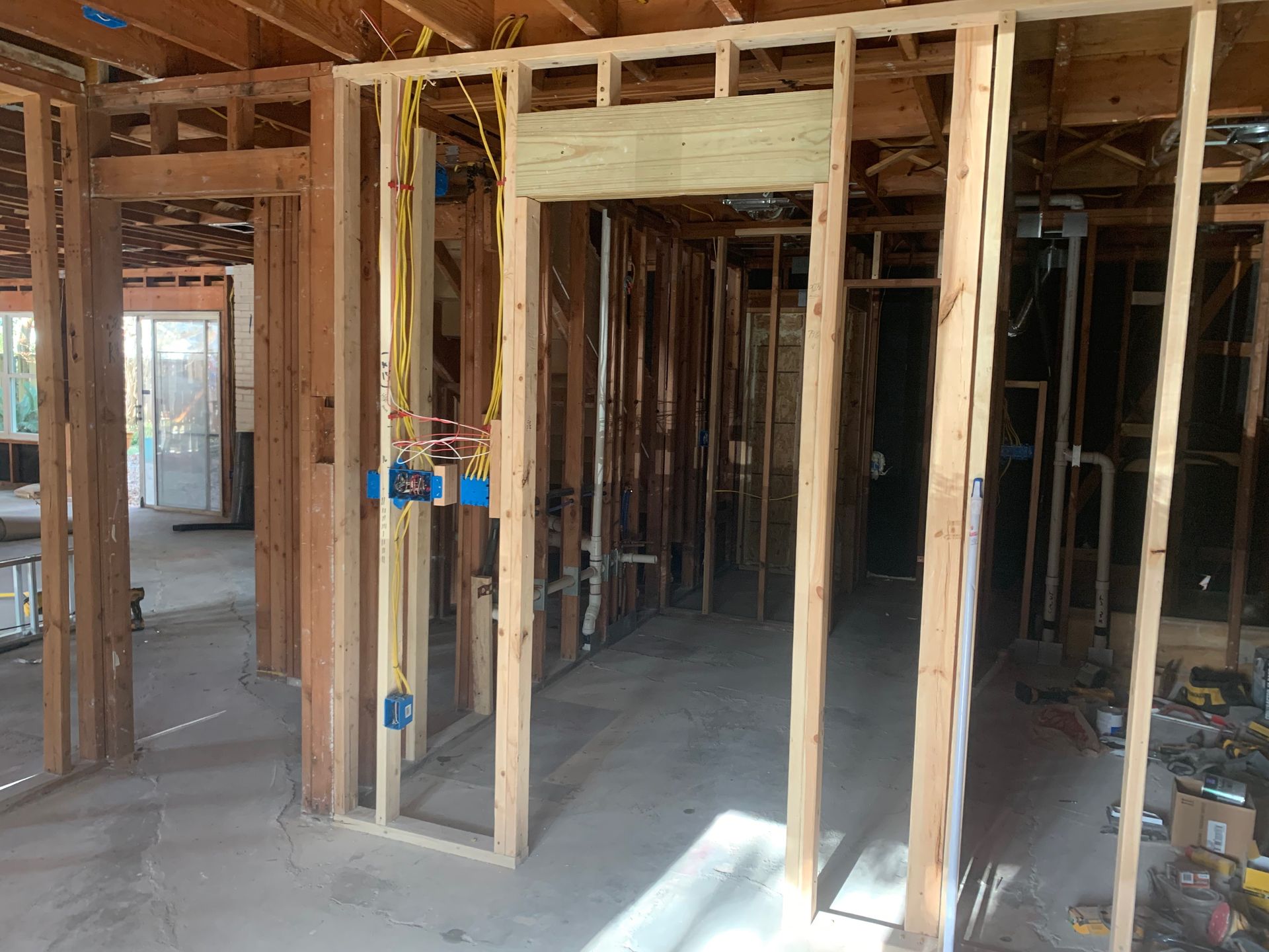 A house is being built with wooden beams and a door.