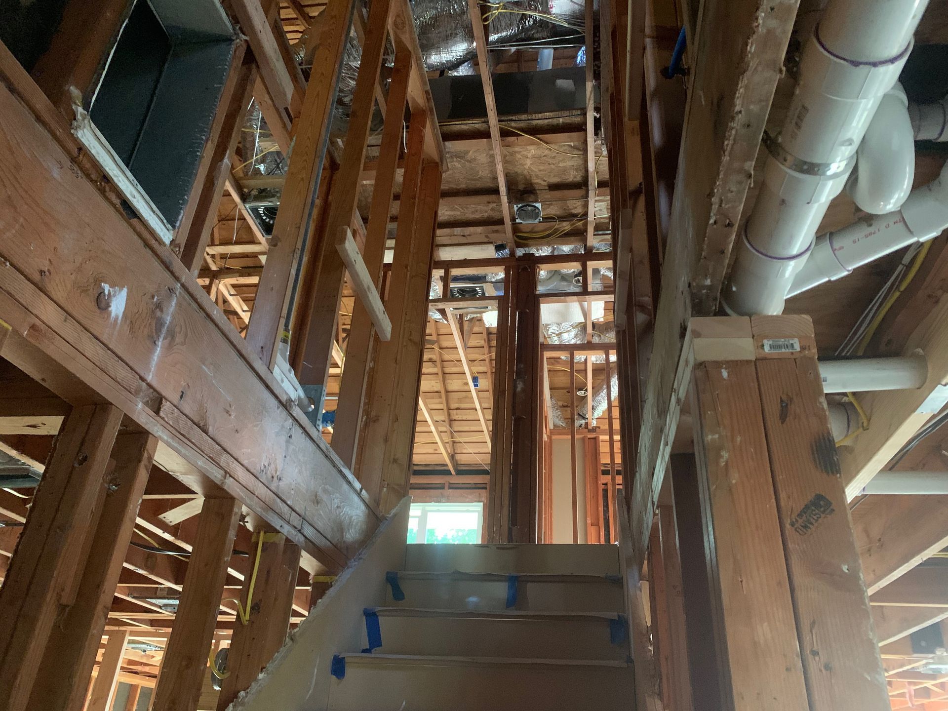 Looking up at the ceiling of a building under construction.