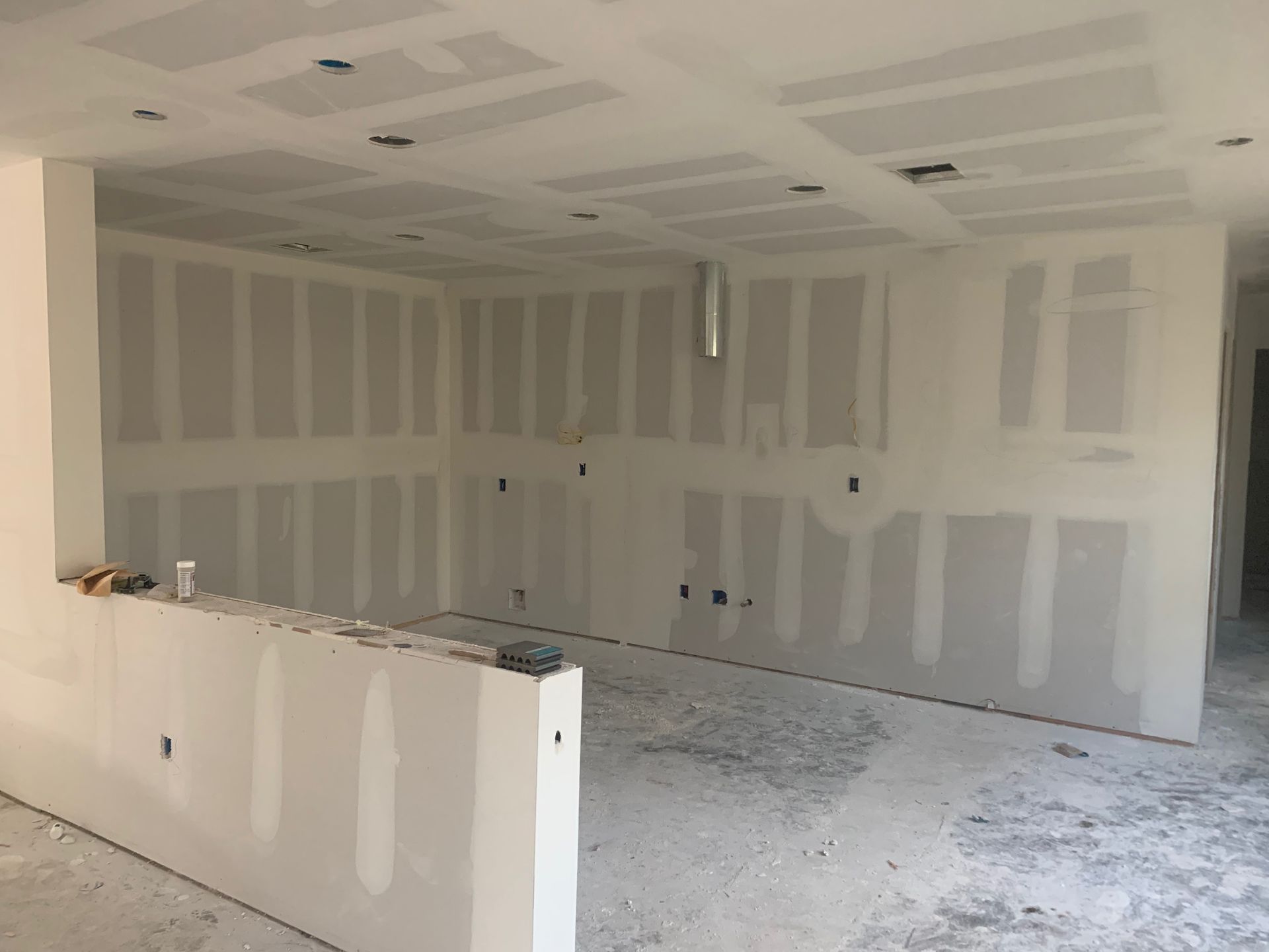 A room with a lot of drywall on the walls.