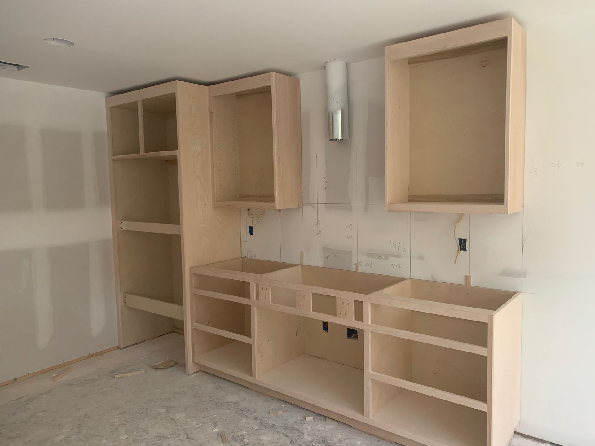 A room with a lot of shelves and cabinets in it.