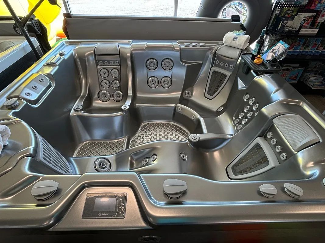 A large hot tub is sitting on top of a table in a store.