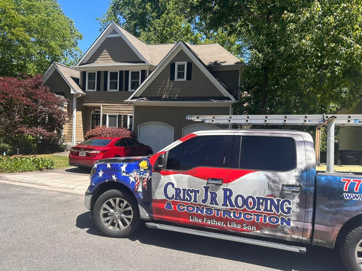 Crust Jr Roofing service truck parked in front of a suburban house and driveway