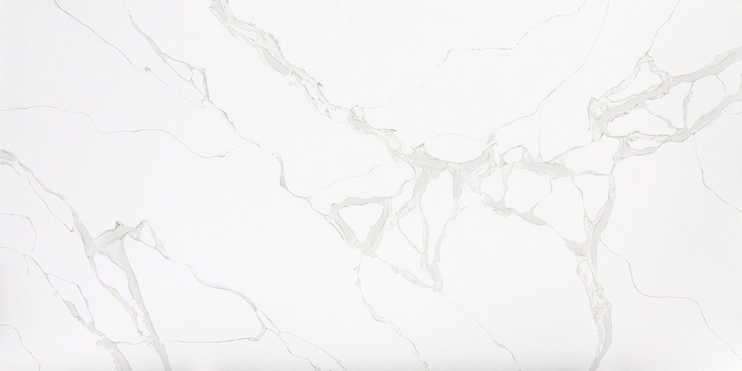 A close up of a white marble counter top.