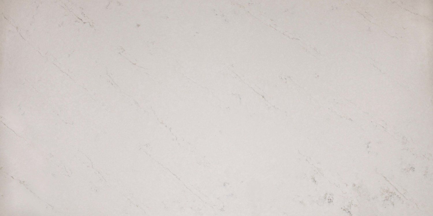 A close up of a white marble counter top.