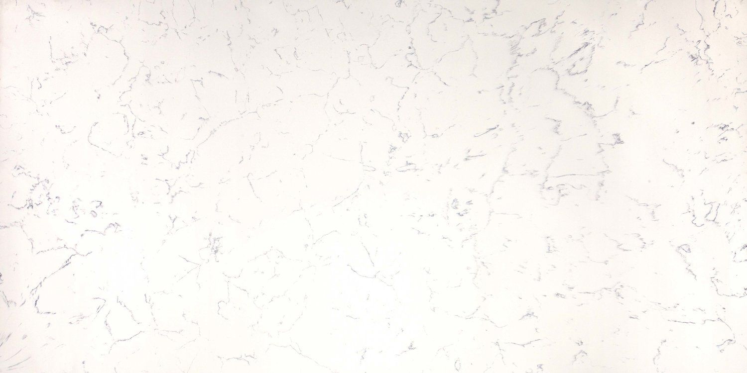 A close up of a white marble counter top.