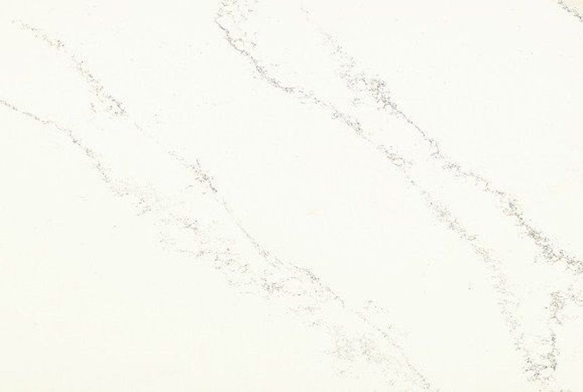 A close up of a white marble counter top.