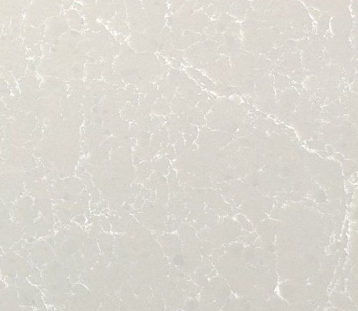 A close up of a white tile with a marble texture.