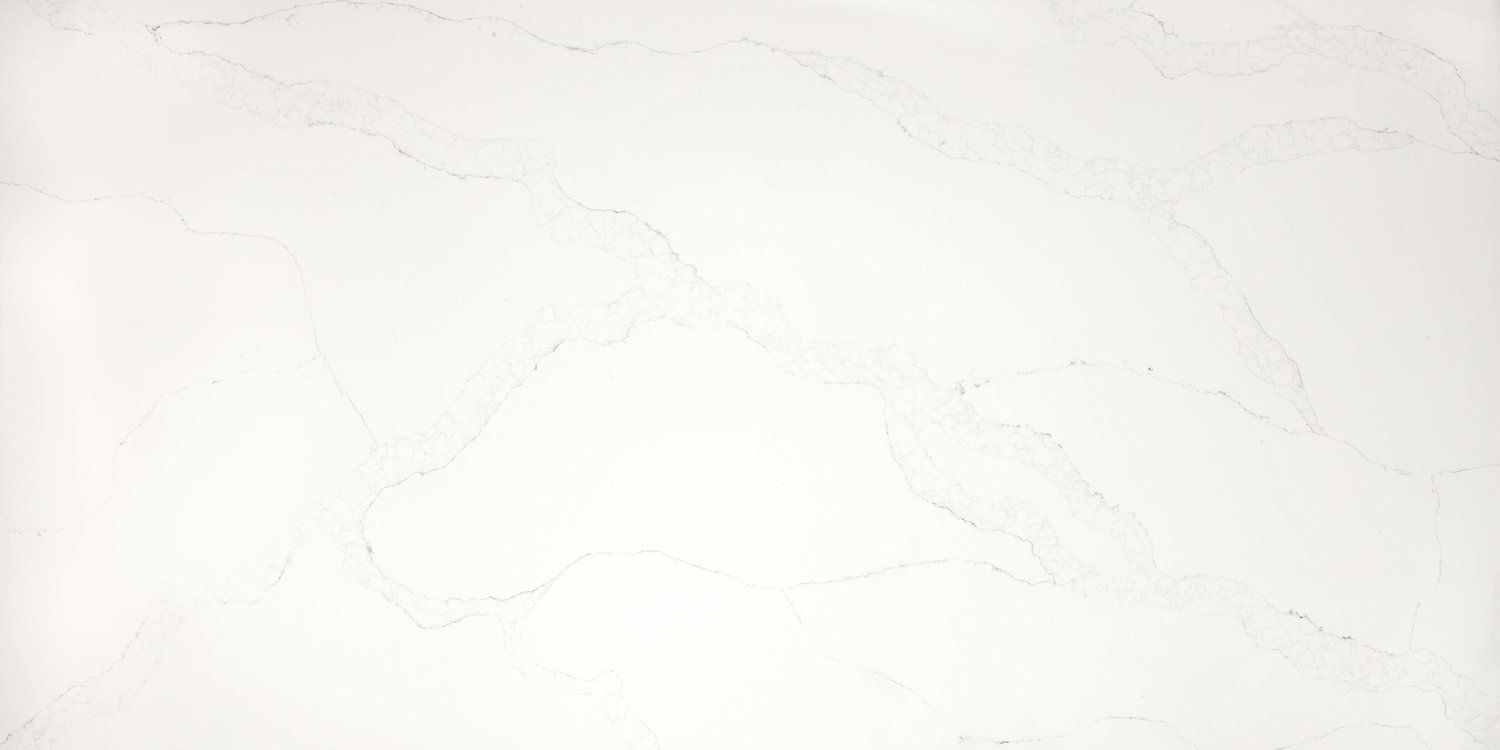 A close up of a white tile with a marble texture.