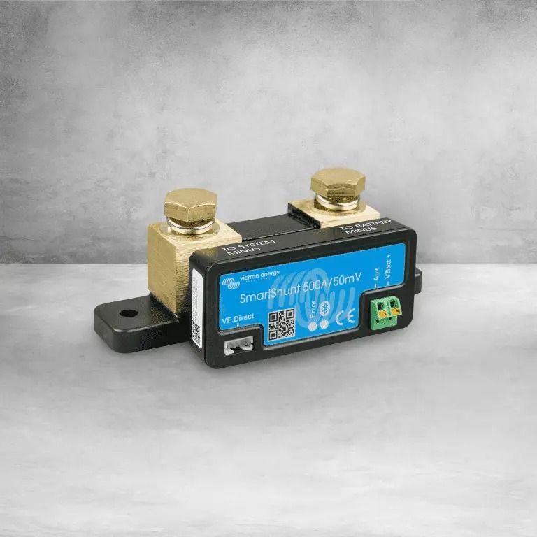 Current sensor with brass terminals, mounted on a black base, blue and black electronic housing.