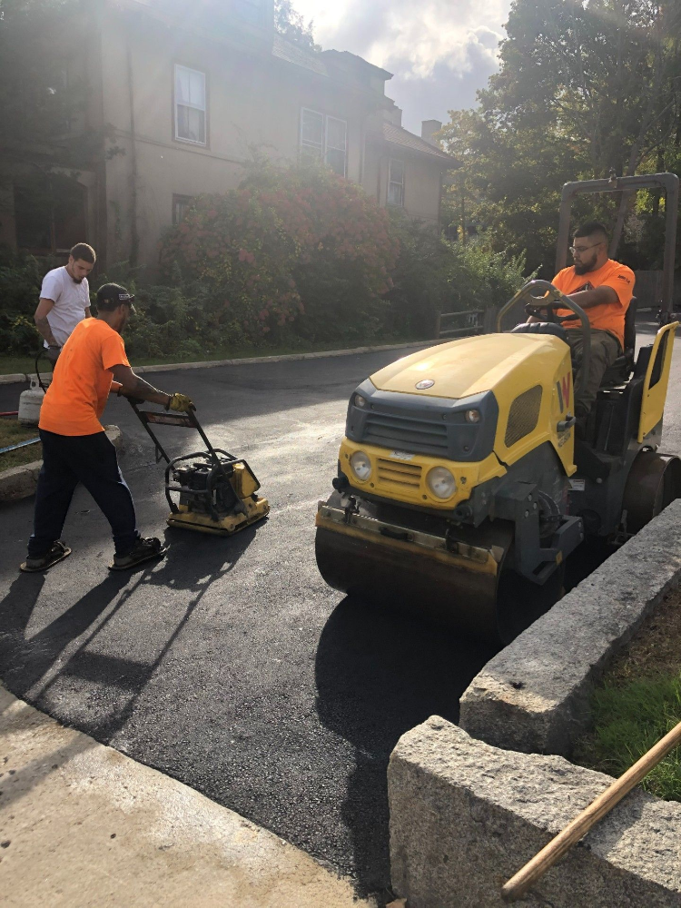 A group of men are working on a road.