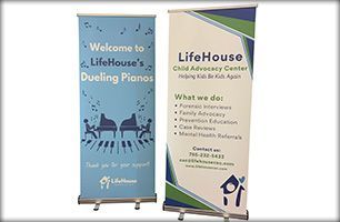 Learn more about banners Two banners are sitting next to each other on a white background