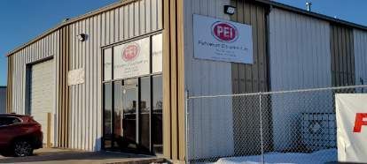 A large building with a fence around it