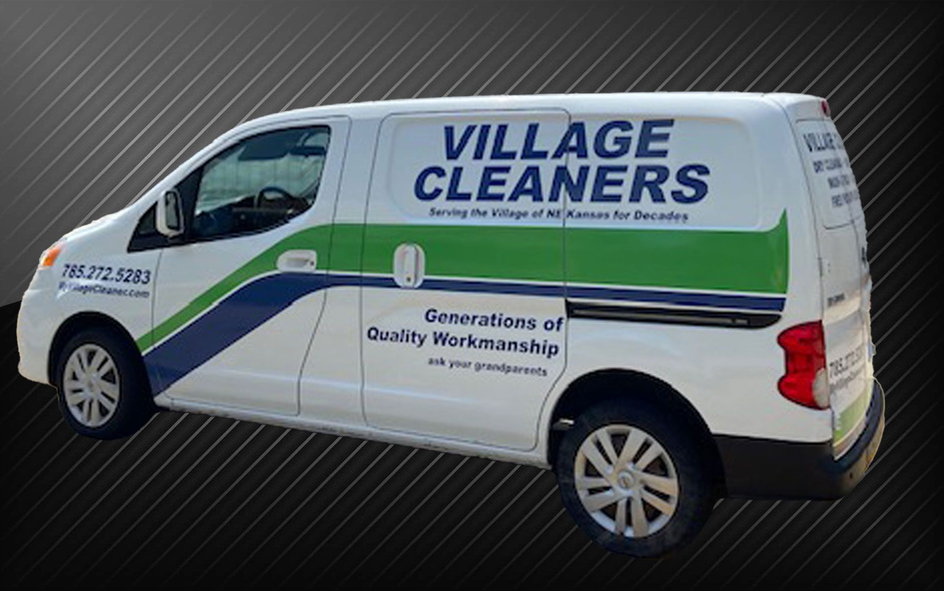 A white van that says village cleaners on the side