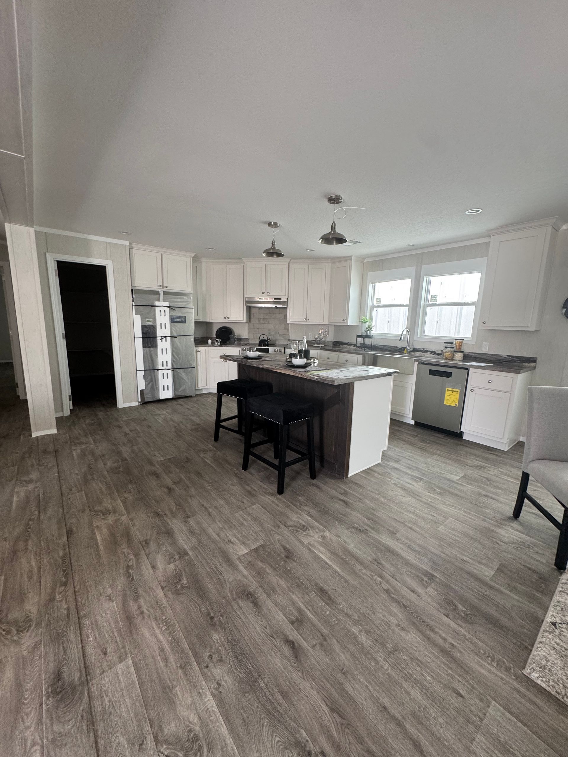 A kitchen with a large island in the middle of the room.