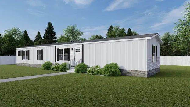 White single-story modular home with black shutters, door, and trim, set on green grass with trees and a blue sky.