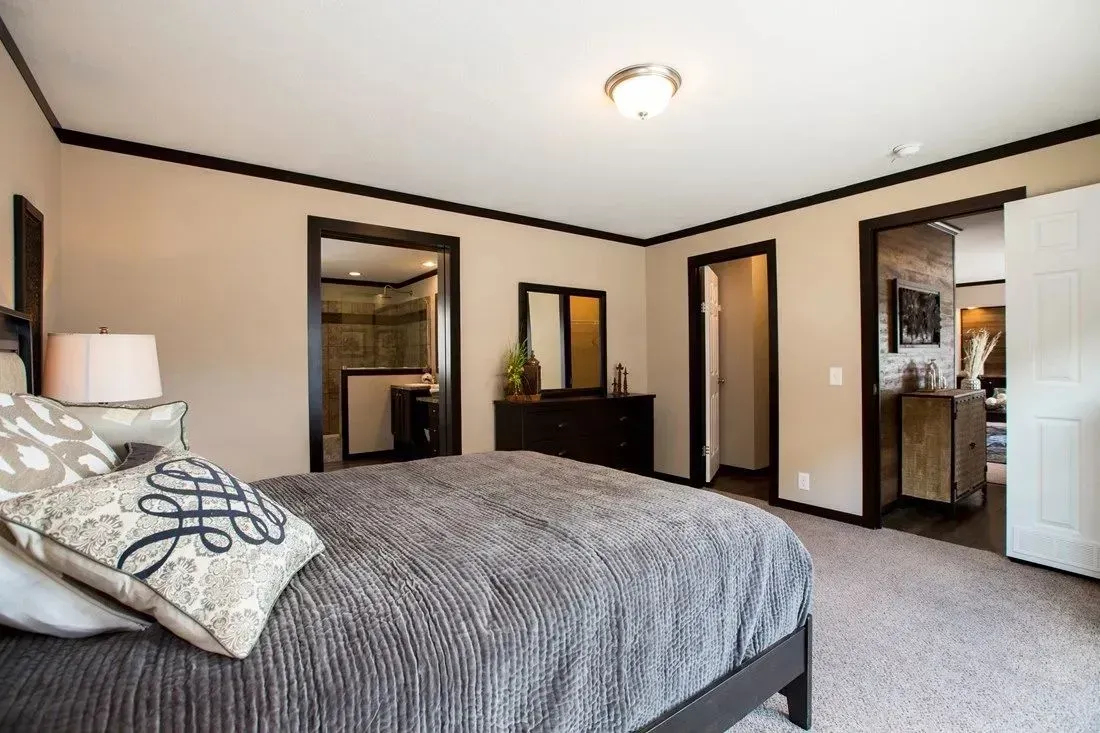 There is a large bed in the middle of the room