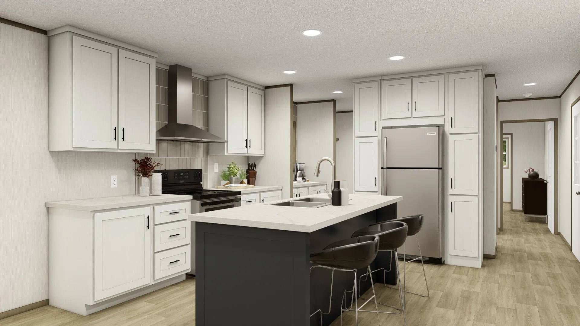 A kitchen with white cabinets , stainless steel appliances , and a large island.