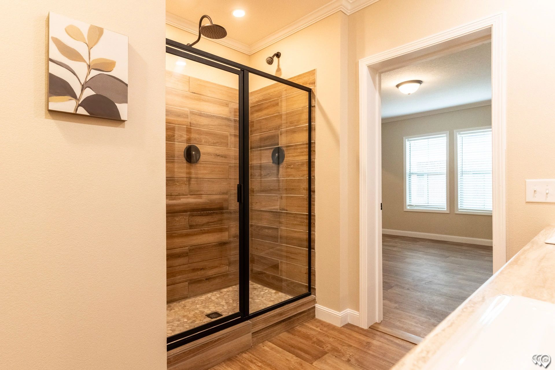 A bathroom with a walk in shower and a bathtub.
