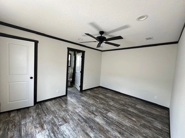 There is a ceiling fan in the corner of the room.