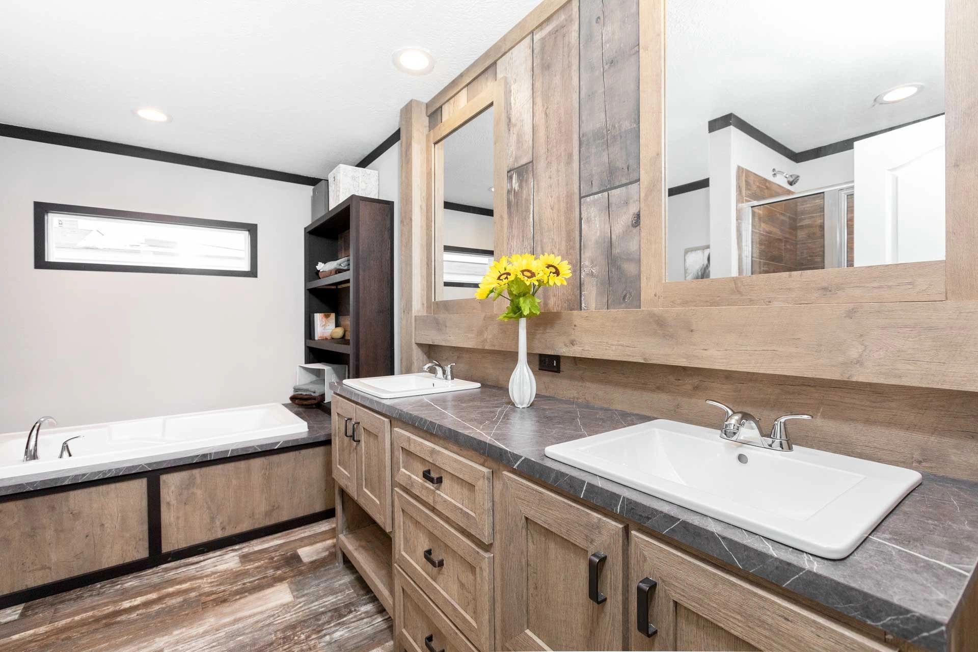 A bathroom with two sinks and a bathtub.