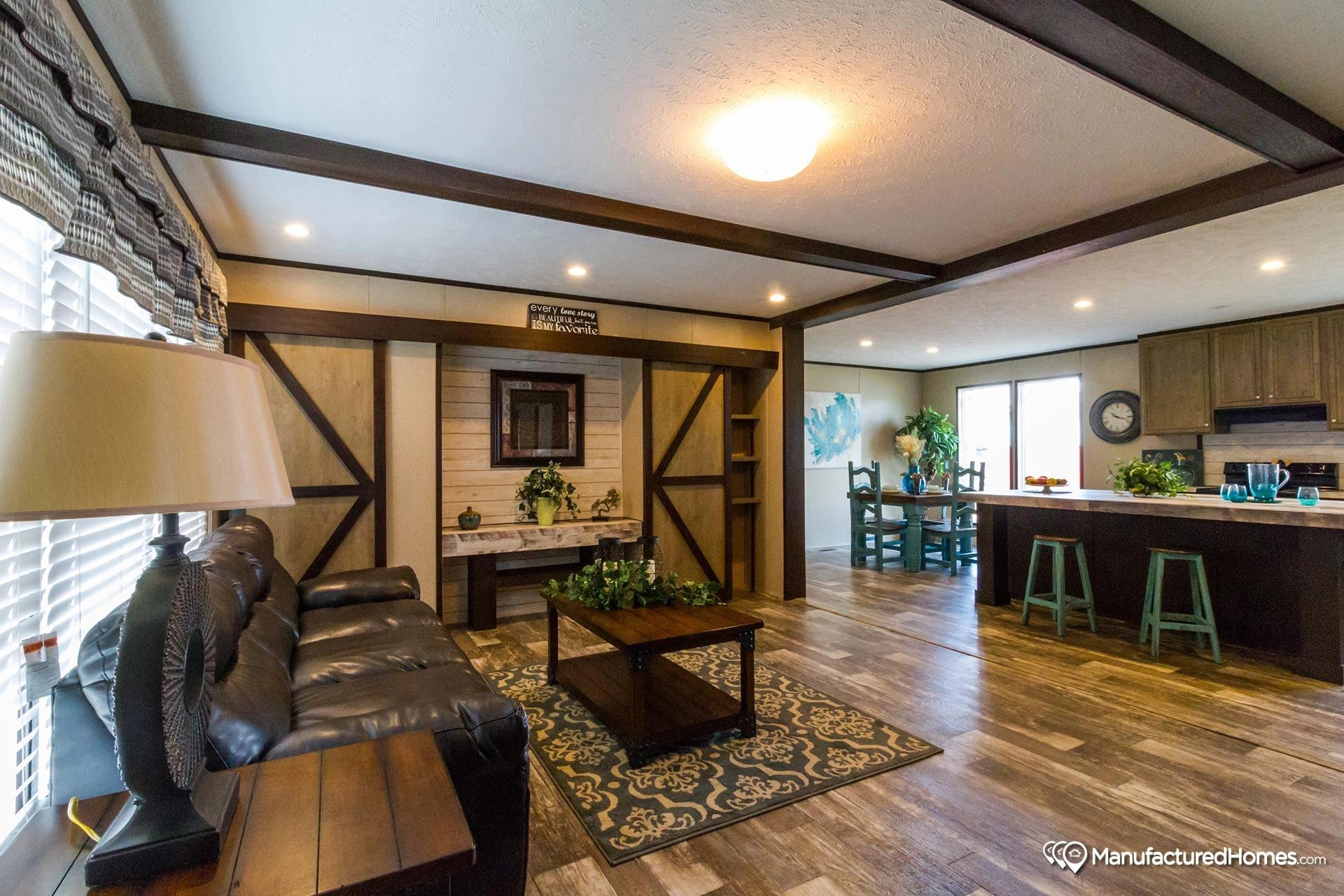 A living room with a couch and a coffee table in a house.