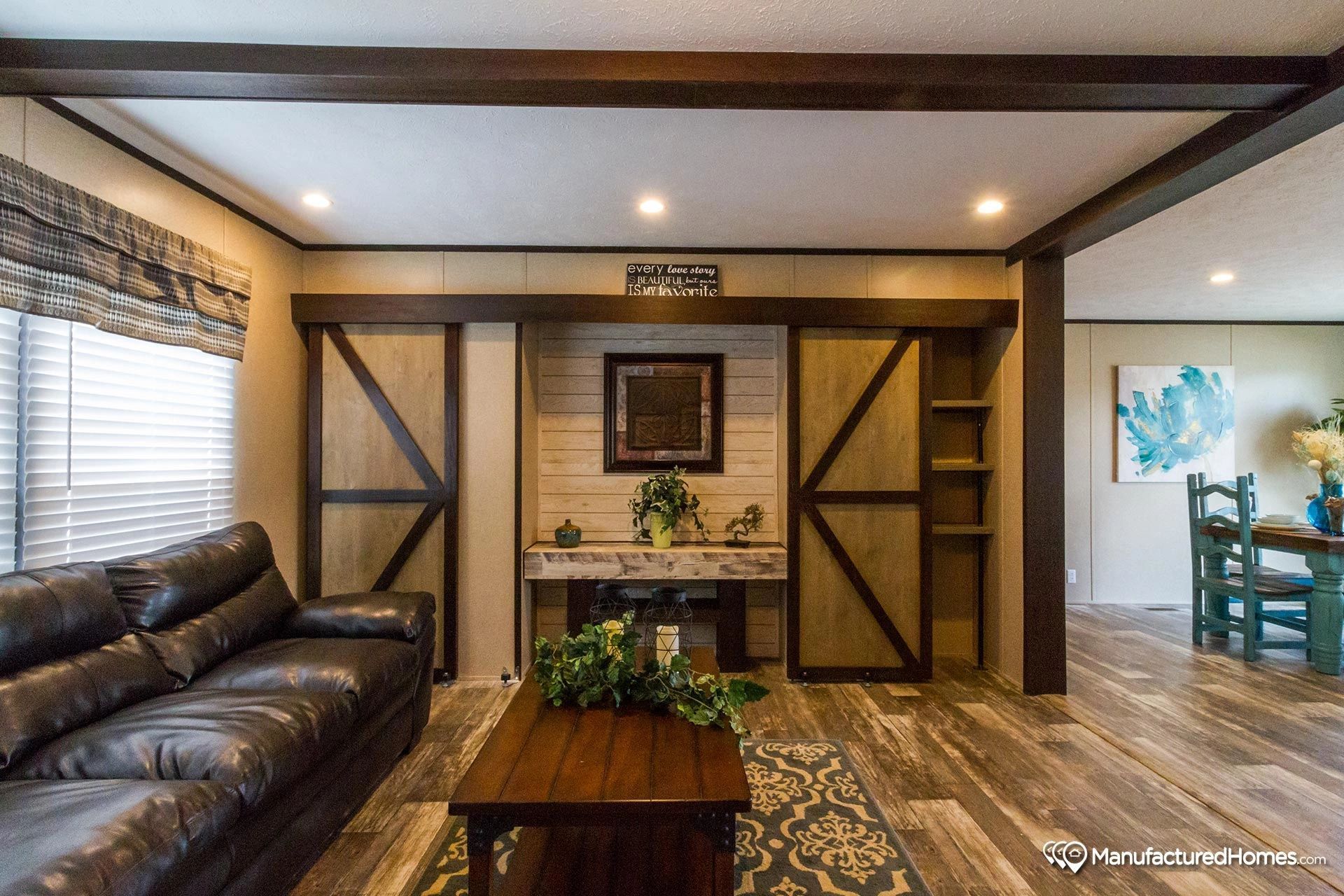 A living room with a couch , table , and television.