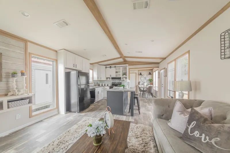 A living room in a mobile home with a couch and a coffee table.