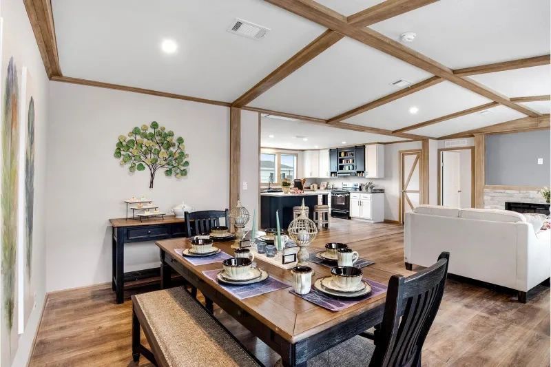 There is a dining table and chairs in the middle of the room.