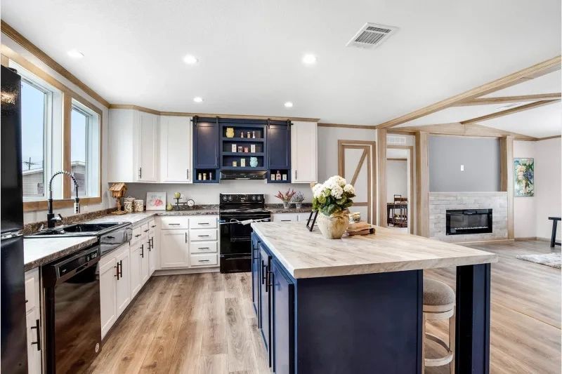 A kitchen with a large island in the middle of it.
