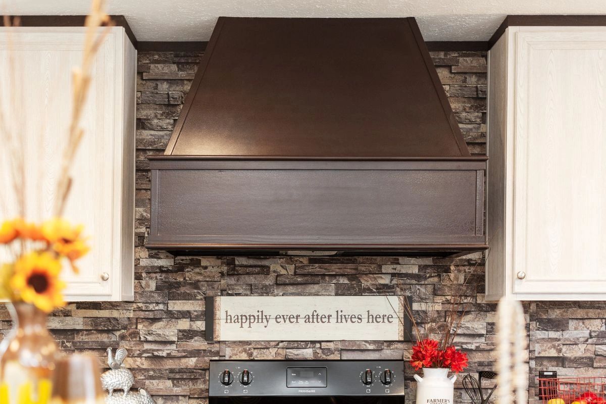 A kitchen with a sign that says happily ever after lives here